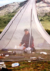 Pete cooking in the bug tent.